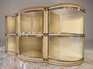Interior glass front niches, indoor columbarium niches, custom design and custom built, granite, marble, strip lighting, in-house manufacturing and engineering, premium construction, elegant aesthetic, corner glass, curved glass, columbarium display for urns and memorabilia,